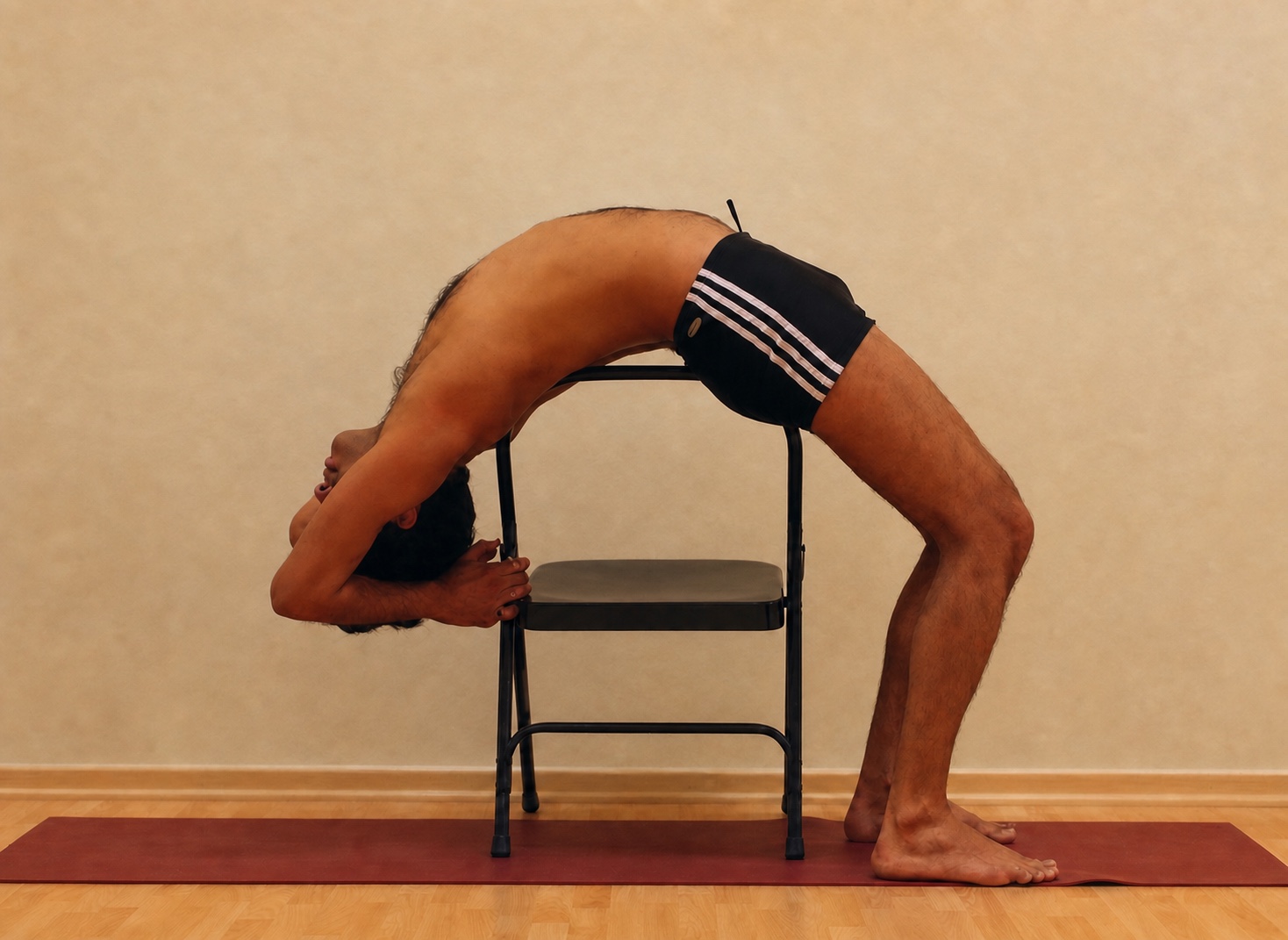 Chair-Supported Backbend yoga practice demonstrated by Pankaj Sharma