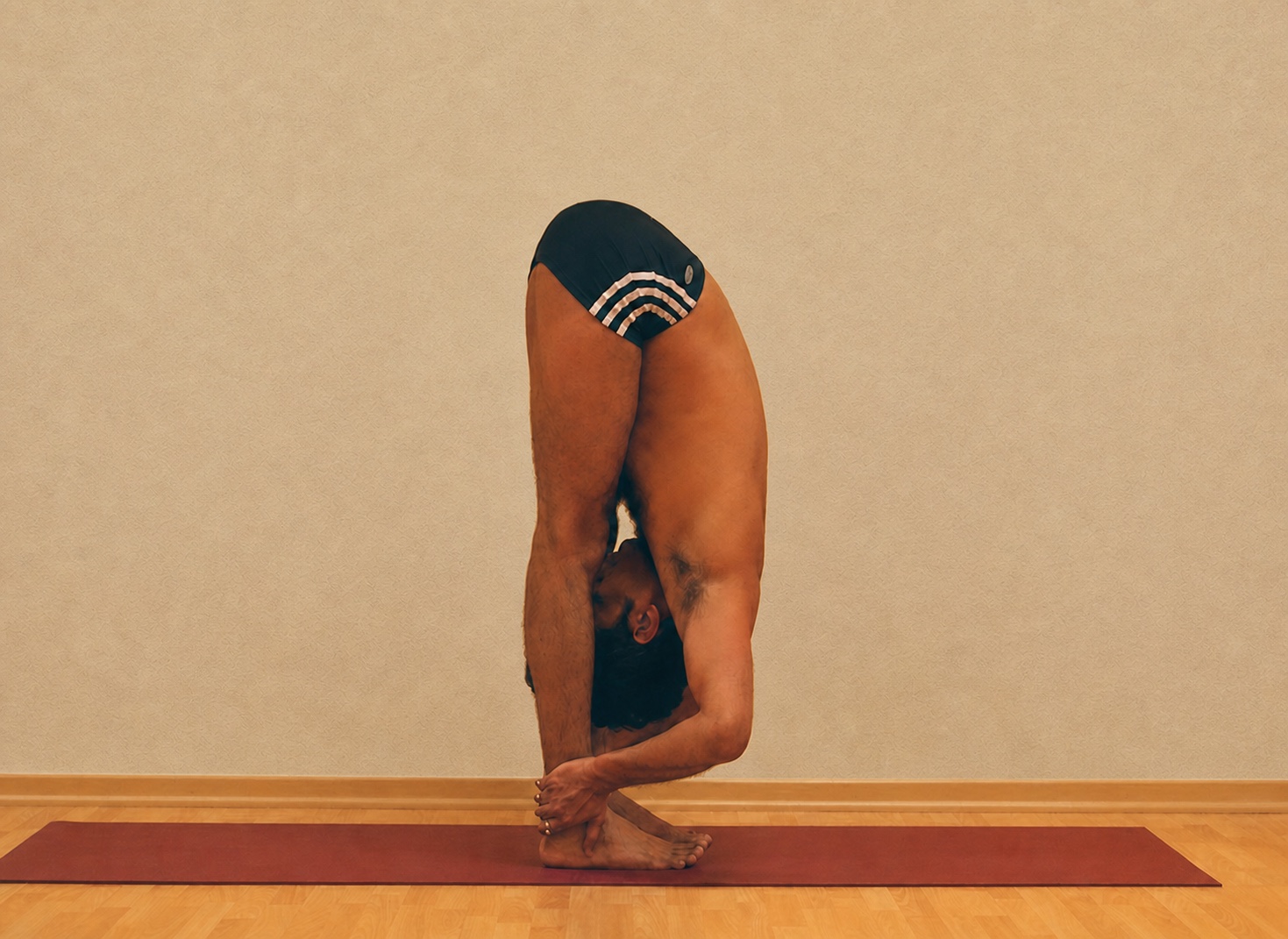 Uttanasana yoga practice demonstrated by Pankaj Sharma